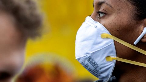 Ditching masks may feel strange to some people after a year of wearing them, one expert says.