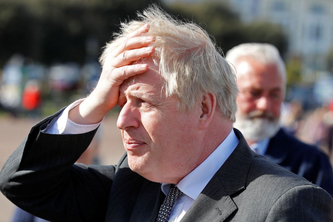 Britain's Prime Minister Boris Johnson gestures as he campaigns in Llandudno, north Wales on April 26, 2021