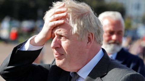 Britain's Prime Minister Boris Johnson gestures as he campaigns in Llandudno, north Wales on April 26, 2021