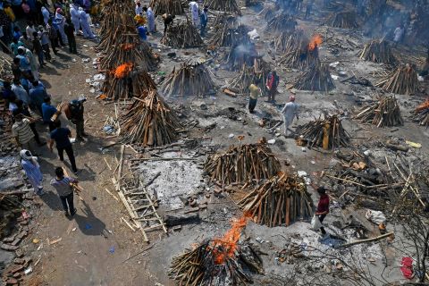 Multiple funeral pyres burn in New Delhi on April 27.