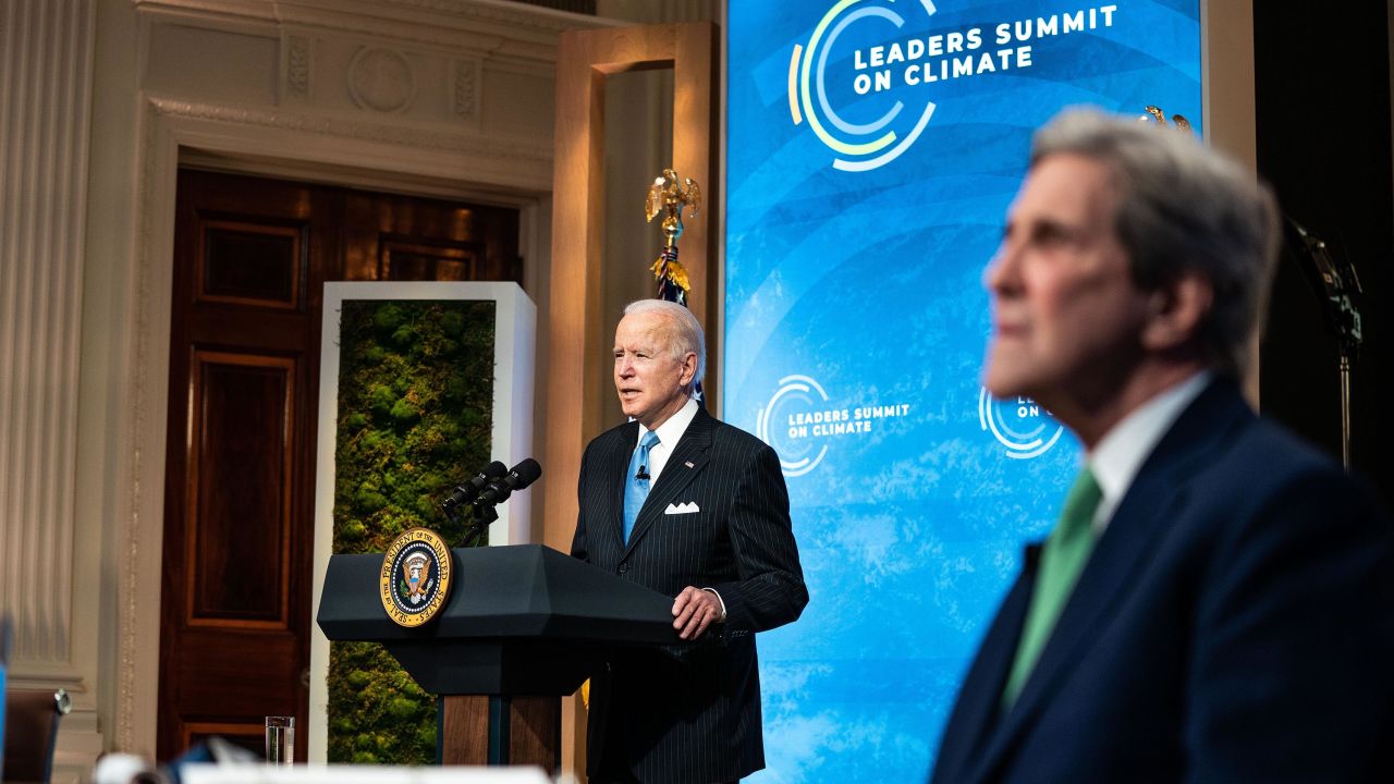 President Joe Biden, left, delivering remarks alongside Special Presidential Envoy for Climate John Kerry on the second day of the virtual climate summit on April 23.