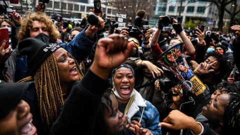People celebrate outside the Hennepin County Government Center in Minneapolis on April 20, 2021, as the verdict is announced in the trial of former police officer Derek Chauvin.