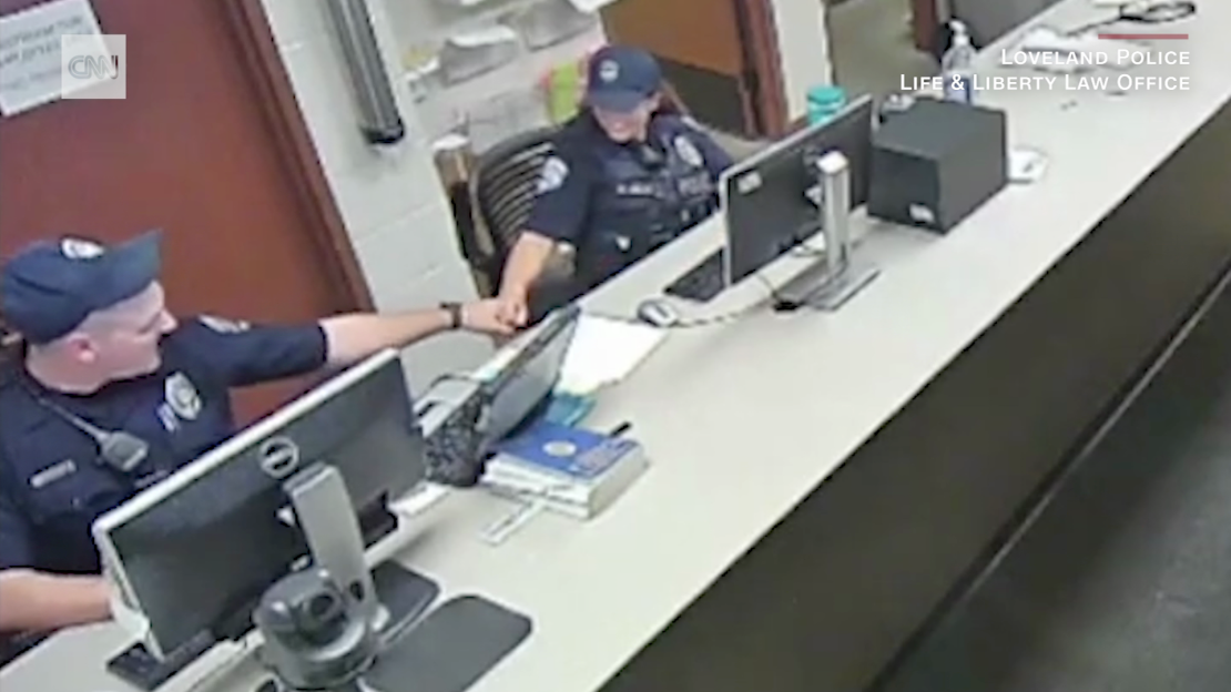 Officers shown on video fist bumping while having discussions about the arrest of Karen Garner on June 26, 2020.
