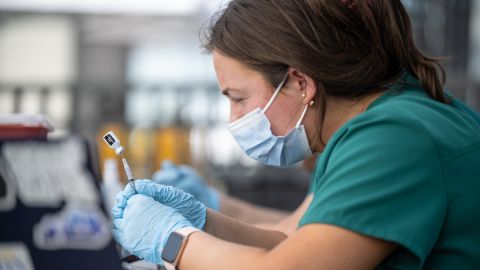  Nurses fill syringes of Pfizer Covid-19 vaccines during a pop-up vaccination event in Louisville, Kentucky on April 26, 2021 