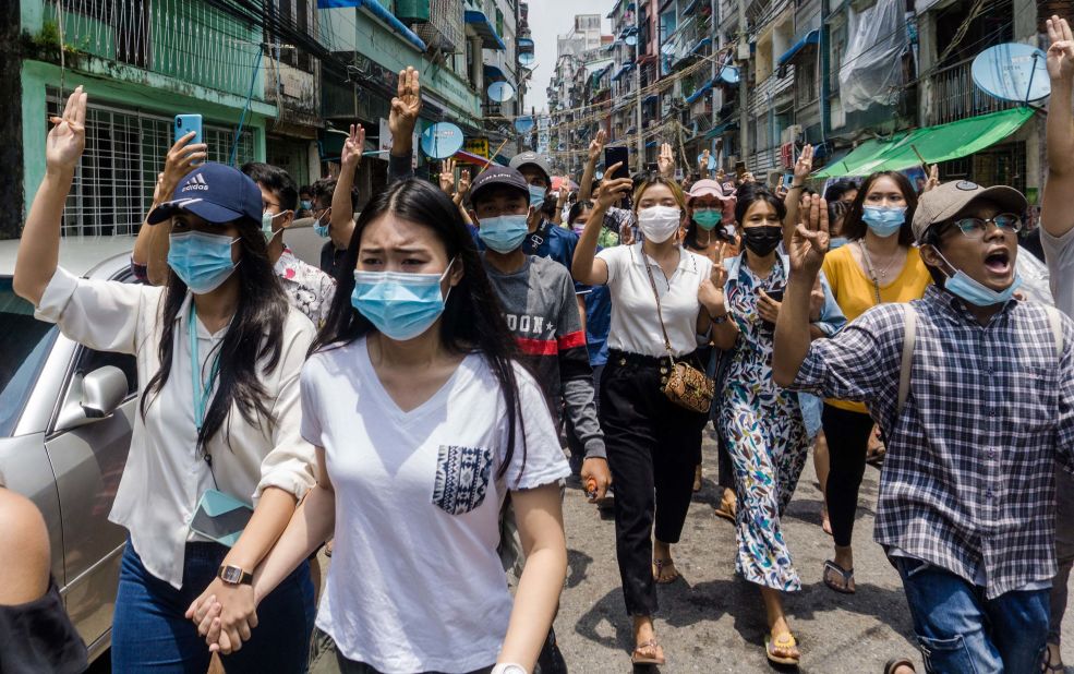 Protesters make the three-finger salute of resistance during an anti-coup demonstration in Yangon, Myanmar, on Tuesday, April 27.