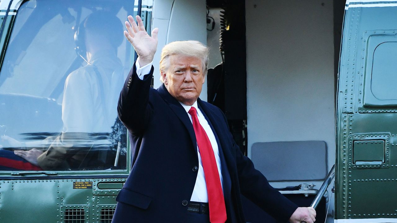 In this January 20, 2021, file photo, outgoing President Donald Trump waves as he boards Marine One at the White House.