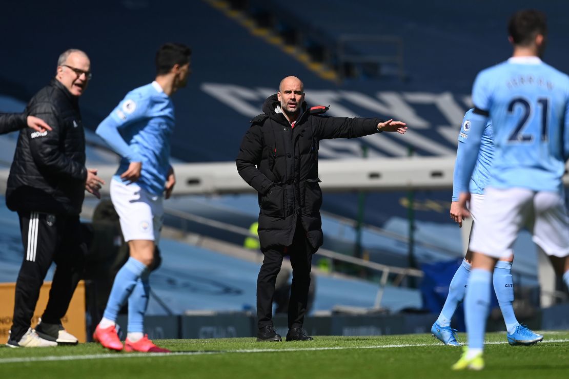 Guardiola gives his team instructions during the Premier League match between Manchester City and Leeds United.