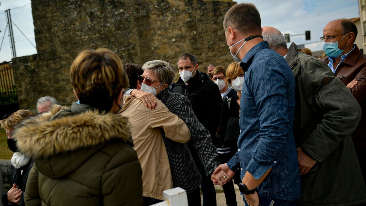 Angelines Amatraiain, center, David Beriain's mother, is hugged by a wellwisher, during a minute of silence in his birthplace of Artajona, northern Spain, on Wednesday. 