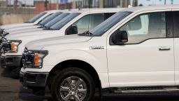 In this Sunday, April 25, 2021, photograph, a long row of unsold 2021 F150 pickup trucks sits at a dealership in east Denver. (AP Photo/David Zalubowski)