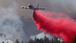 ANGWIN, CALIFORNIA - SEPTEMBER 27: The Global Supertanker drops retardant ahead of the Glass on September 27, 2020 in Angwin, California. The fast moving Glass fire has burned over 1,000 acres and has destroyed homes. Much of Northern California is under a red flag warning for high fire danger through Monday evening. (Photo by Justin Sullivan/Getty Images)