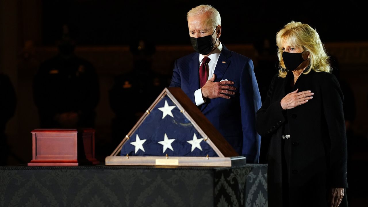 The first lady and President Joe Biden pay their respects to US Capitol officer Brian D. Sicknick as he lies in honor in the US Capitol in February.