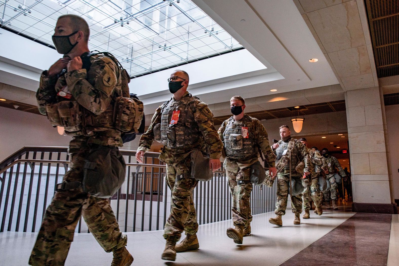 Military personnel walk inside the Capitol Visitor Center earlier on Wednesday.
