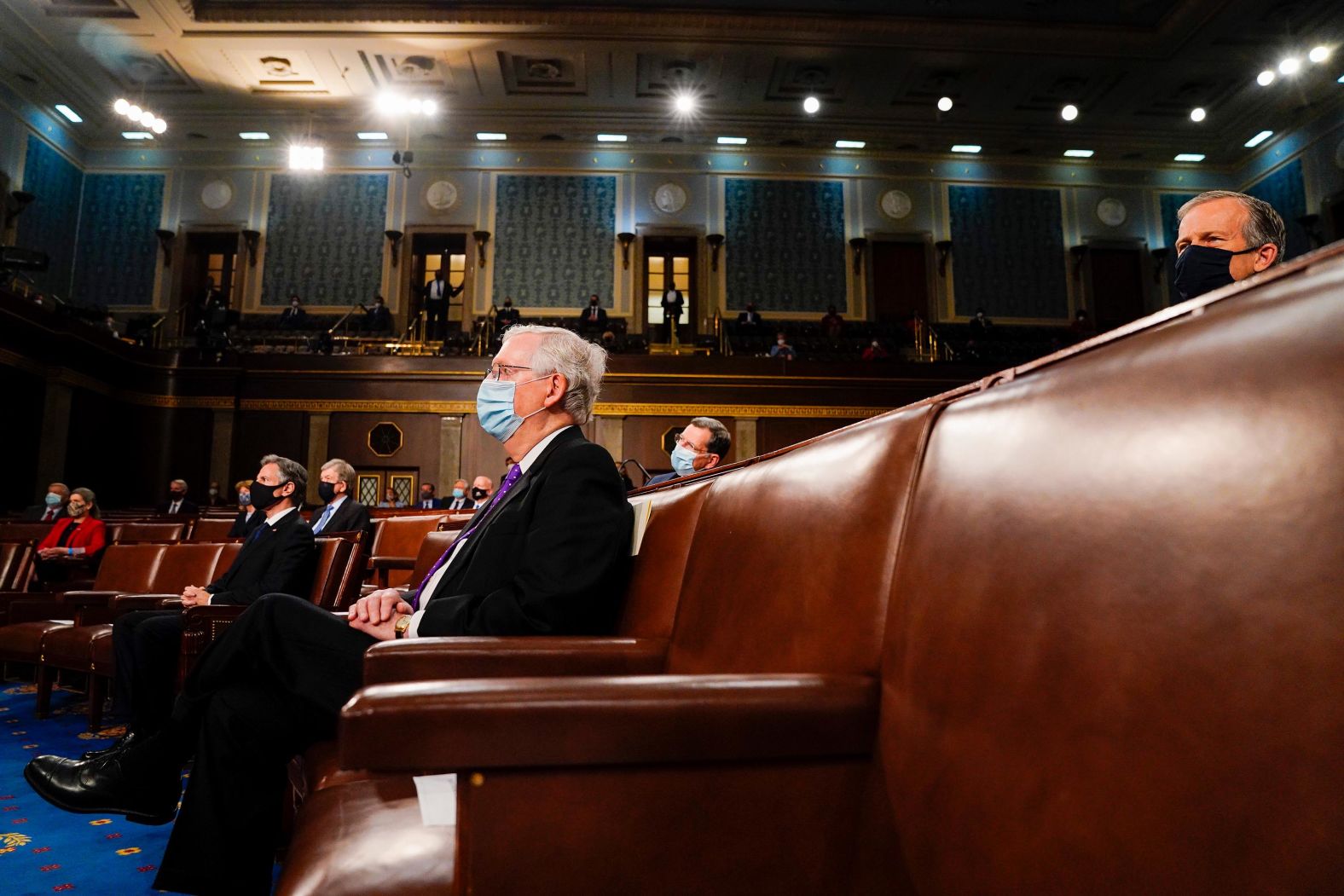 Senate Minority Leader Mitch McConnell listens to the President's speech.