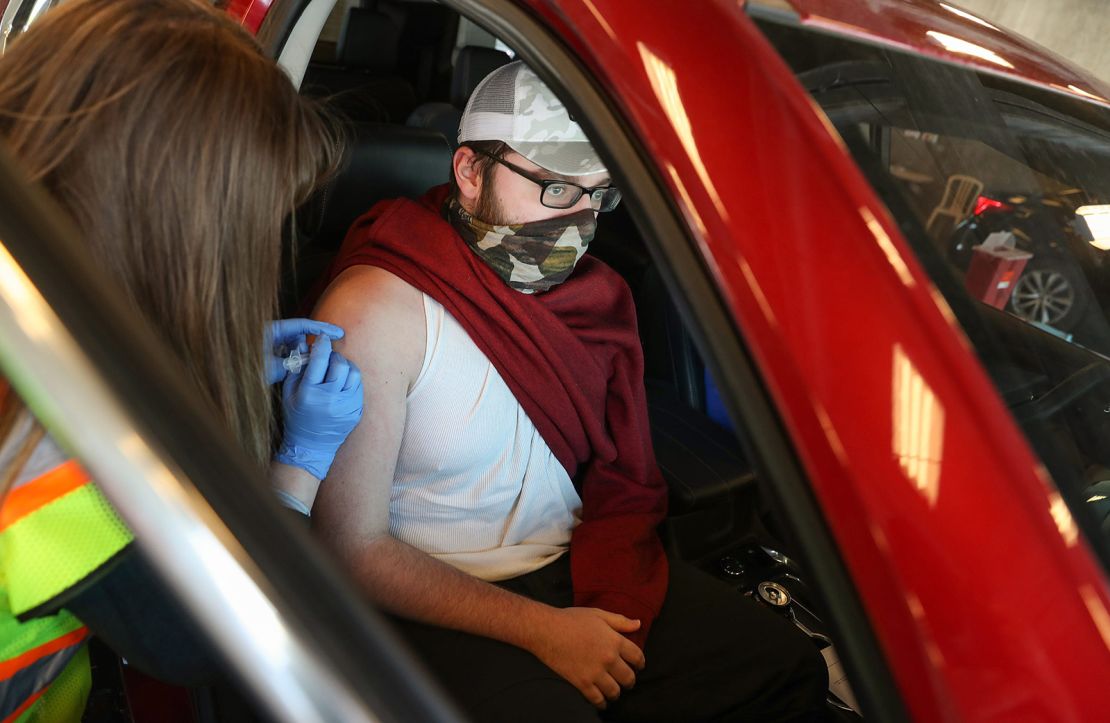 A pharmacy resident gives a Johnson & Johnson Covid-19 vaccine at the Indianapolis Motor Speedway on April 25, 2021