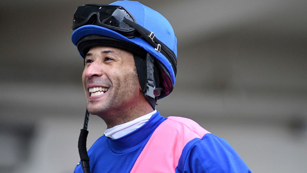 Carmouche smiling in the paddock at Aqueduct Racetrack in the Queens borough of New York.
