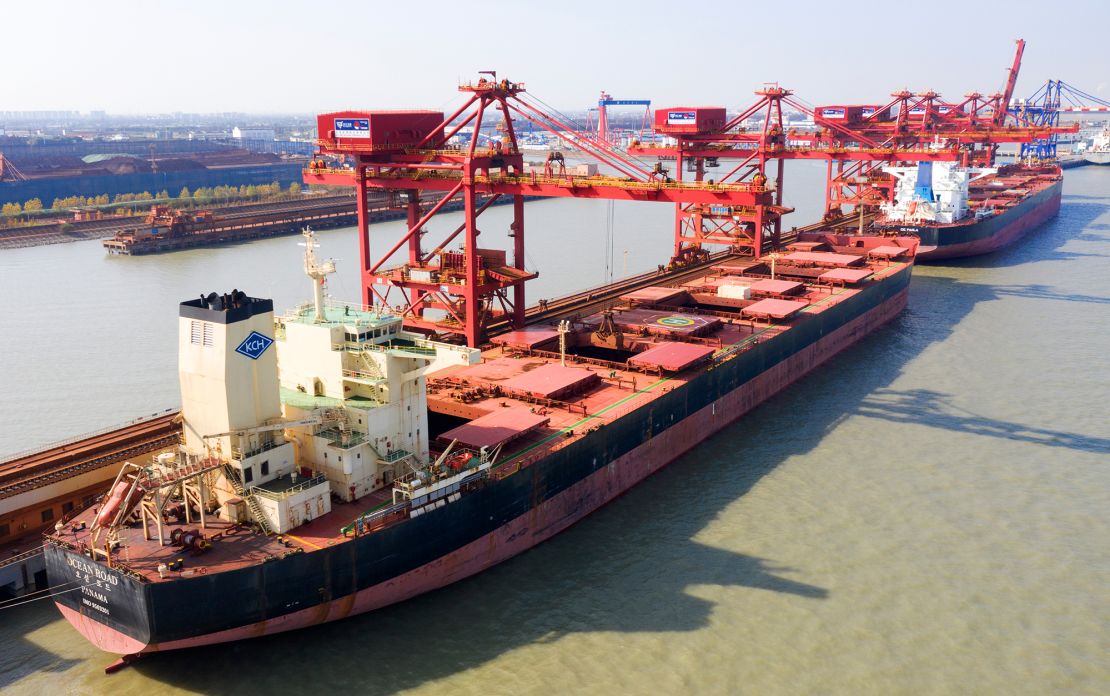 A ship unloading iron ore imported from Australia in Taicang Port in eastern China. 