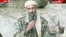AFGHANISTAN:Saudi-born alleged terror mastermind Osama bin Laden is seen in this video footage recorded "very recently" at an undisclosed location in Afghanistan aired by the Qatar-based satelite TV station al-Jazeera 07 October 2001. Retaliatory strikes against Afghanistan began 07 October with US and British forces bombing terrorist camps, air bases and air defense installations in the first stage of its campaign against the Taliban regime for sheltering bin Laden, who is the "prime suspect" in the 11 September attacks in the US. Al-Jazeera reported that the video was shot to be broadcast after the first US bombings.     AFP PHOTO/AL-JAZEERA (Photo credit should read AFP via Getty Images)