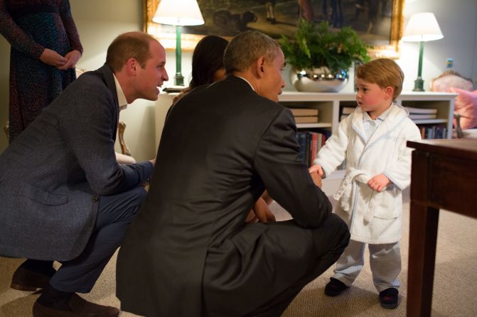 US President Barack Obama talks to Prince George while visiting Kensington Palace in 2016.