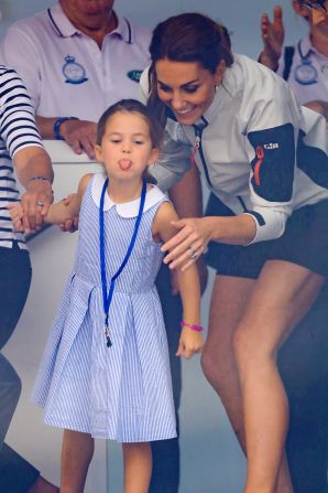 Princess Charlotte playfully sticks out her tongue while attending a King's Cup regatta with her mother in 2019.