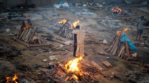 Family members embrace each other at a cremation ground in New Delhi, India, on April 26.