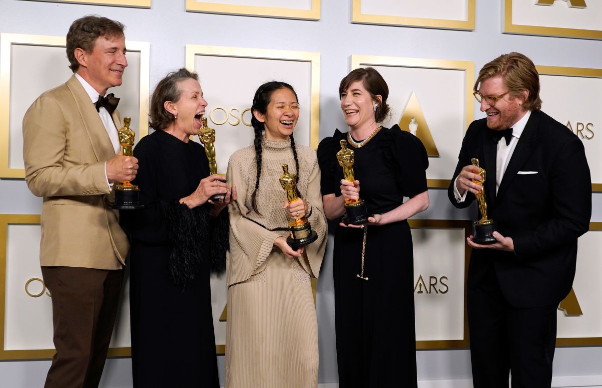 From left, producer Peter Spears, actress Frances McDormand, director Chloé Zhao, producer Mollye Asher and producer Dan Janvey pose with Academy Awards after their film "Nomadland" won best picture on Sunday, April 25. McDormand also won best actress for the third time in her career, and Zhao became the first woman of color and the first woman of Asian descent to win best director. <a href="https://www.cnn.com/2021/04/25/entertainment/gallery/2021-academy-awards-photos/index.html" target="_blank">In pictures: The 2021 Academy Awards</a>