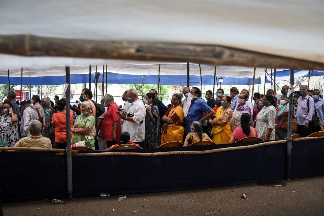 People line up to receive Covid-19 vaccines at a mass vaccination center on April 29 in Mumbai, India.