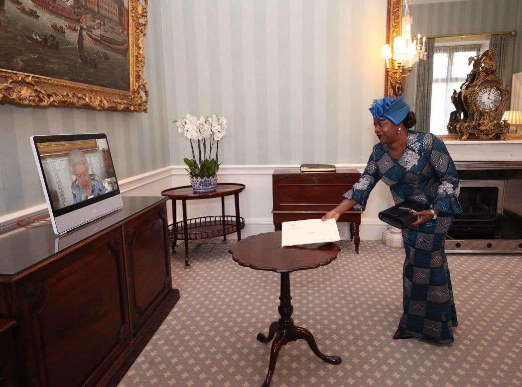 Britain's Queen Elizabeth II is seen on a video screen as she conducts a <a href="https://www.cnn.com/2021/04/27/uk/queen-engagement-intl-scli-gbr/index.html" target="_blank">virtual audience</a> Tuesday, April 27, with Sara Affoue Amani, the ambassador of Ivory Coast.
