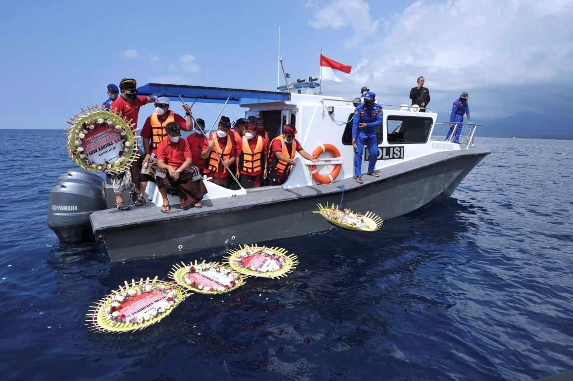 People throw flowers and petals off a boat near Labuhan Lalang, Indonesia, during a prayer Monday, April 26, for the 53 crew members who were aboard a sunken Navy submarine. <a href="https://www.cnn.com/2021/04/25/asia/indonesia-submarine-wreckage-intl/index.html" target="_blank">The wreckage was found on the sea floor</a> and all crew members were confirmed dead.