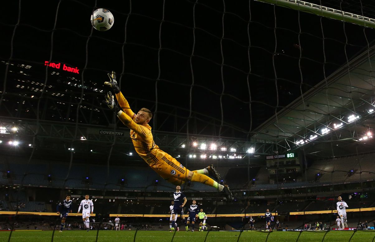 Matt Acton, a goalkeeper with the Melbourne Victory, is beaten by a shot from Nicolai Muller of the Western Sydney Wanderers during an A-League soccer match in Melbourne on Friday, April 23. Melbourne won the match 5-4.