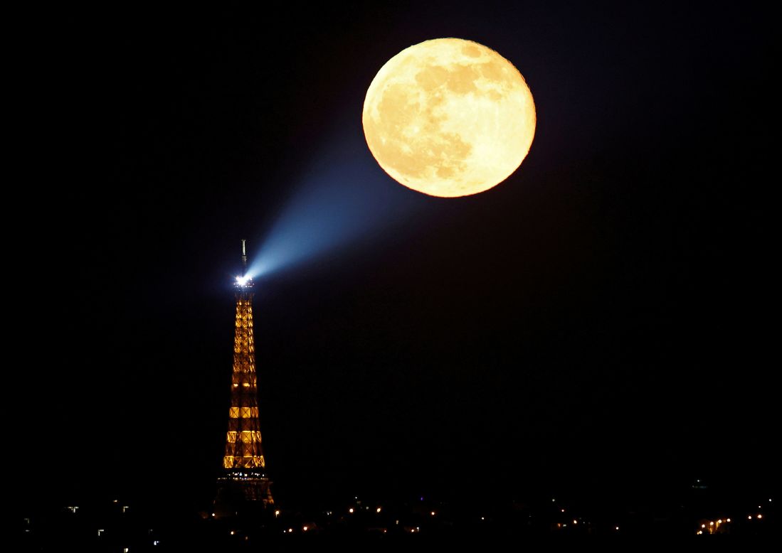 April's full moon, <a href="https://www.cnn.com/2021/04/26/world/pink-supermoon-april-2021-scn/index.html" target="_blank">known as a "pink" supermoon,</a> rises behind the Eiffel Tower in Paris on Tuesday, April 27. <a href="http://www.cnn.com/2021/04/22/world/gallery/photos-this-week-april-16-april-22/index.html" target="_blank">See last week in 40 photos</a>