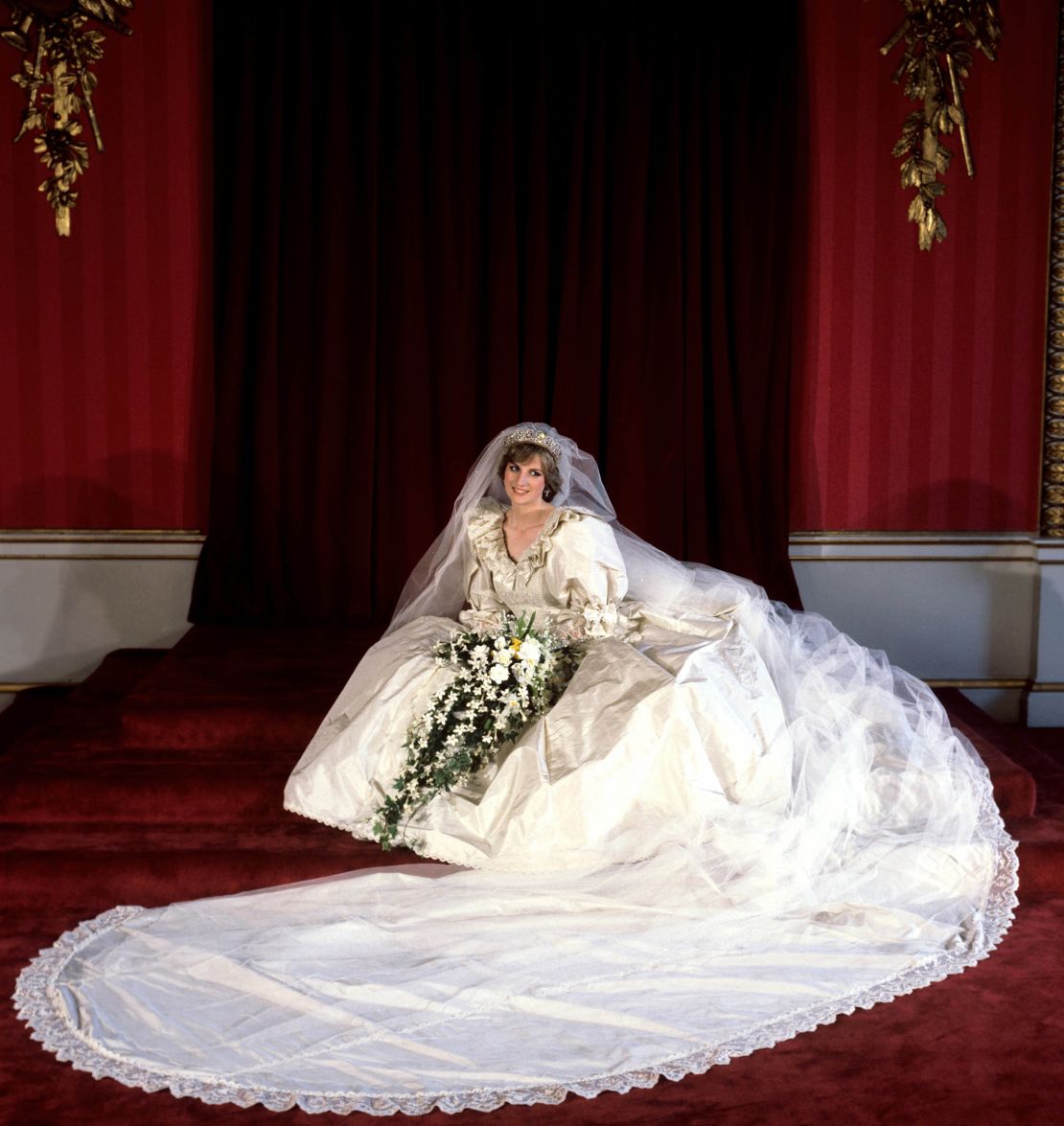 File photo dated 29/07/81 of the Princess of Wales seated in her bridal gown at Buckingham Palace after her marriage to Prince Charles at St. Paul's Cathedral.