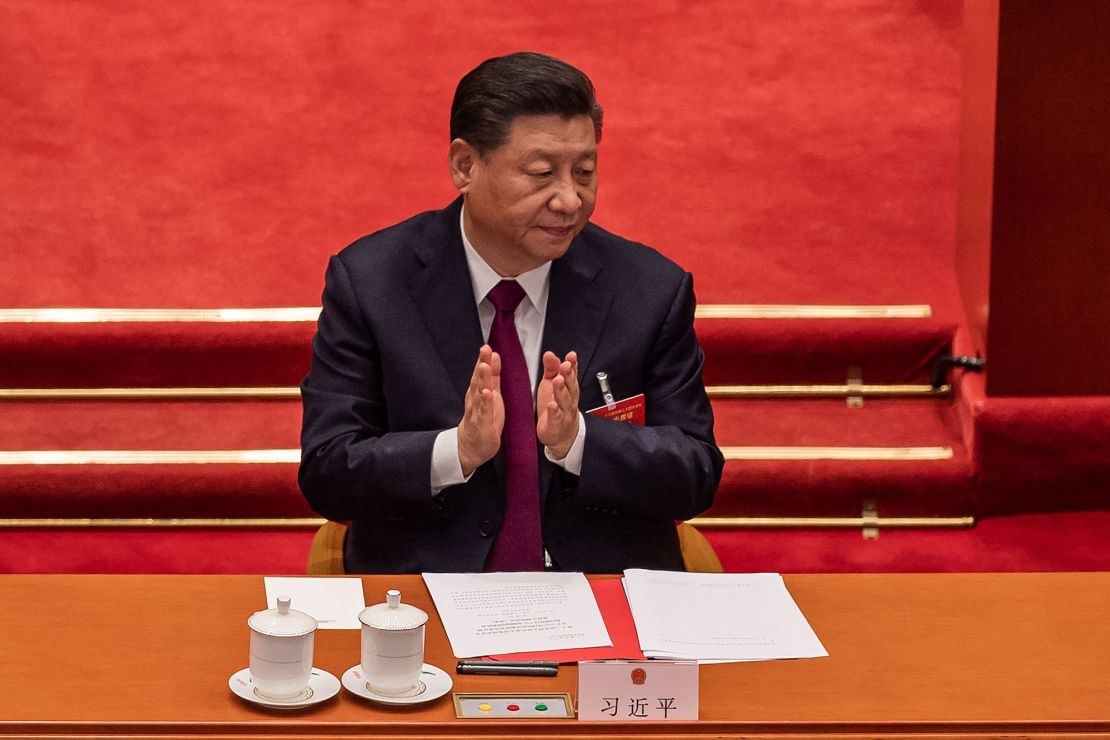 China's President Xi Jinping applauds during the closing session of the National Peoples Congress (NPC) at the Great Hall of the People in Beijing on March 11, 2021.