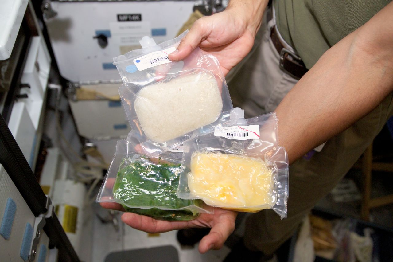 A sampling of processed space food is shown in orbit.