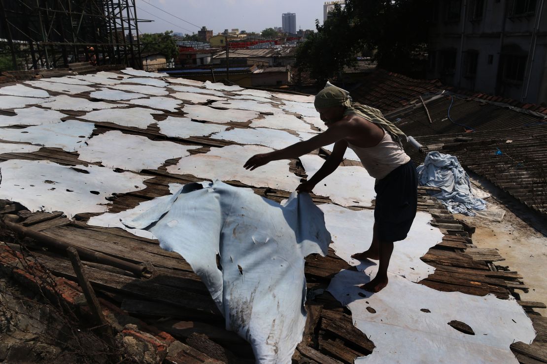 An Indian worker puts strips of leather to dry at a tannery in Kolkata, India on October 11, 2020. 