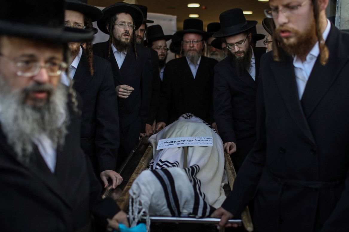 Men attend the funeral of Shmual Tzvi Klagsbald, who was one of the <a href="https://www.cnn.com/middleeast/live-news/israel-mount-meron-stampede-intl/h_976bb5094dae651d463d8ebdafeea985" target="_blank">45 people killed in a stampede</a> Friday, April 30, during a religious festival at Israel's Mount Meron. An estimated 50,000 to 100,000 people had crowded onto the mountain to celebrate the Lag B'Omer holiday.
