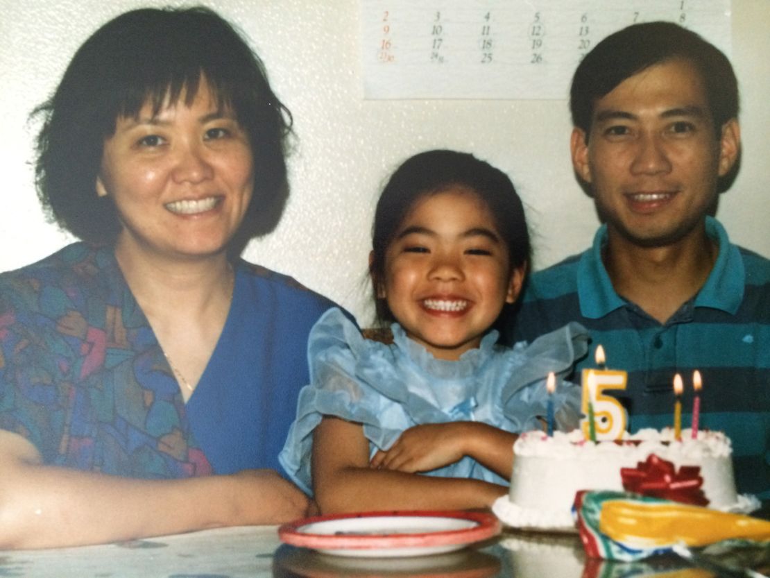 Natasha Chen celebrates her 5th birthday alongside her parents.