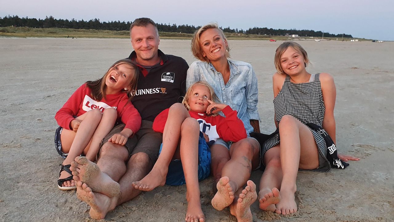 Alix Indigo Holmgaard, center, pictured with her fiancé and children.