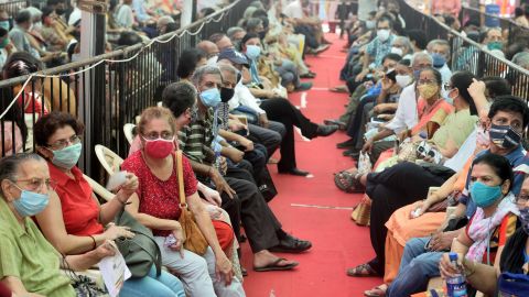 People wait in a queue to get vaccinated against Covid-19 on April 27, 2021 in Mumbai, India.
