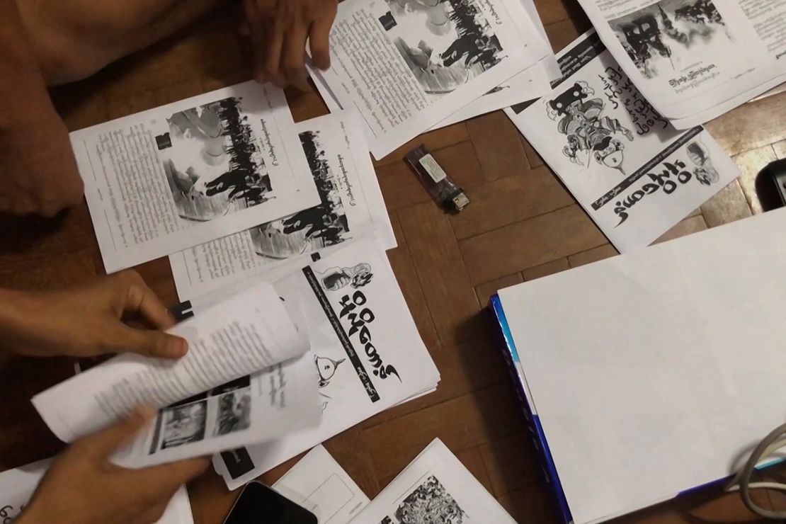 This screengrab provided via AFPTV video footage taken on April 10, 2021 shows an underground newsletter being produced to spread information in Yangon.