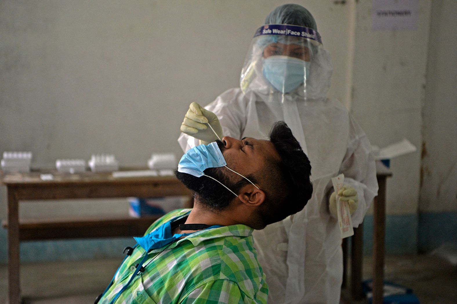 A health worker administers a Covid-19 test in Siliguri on April 30.