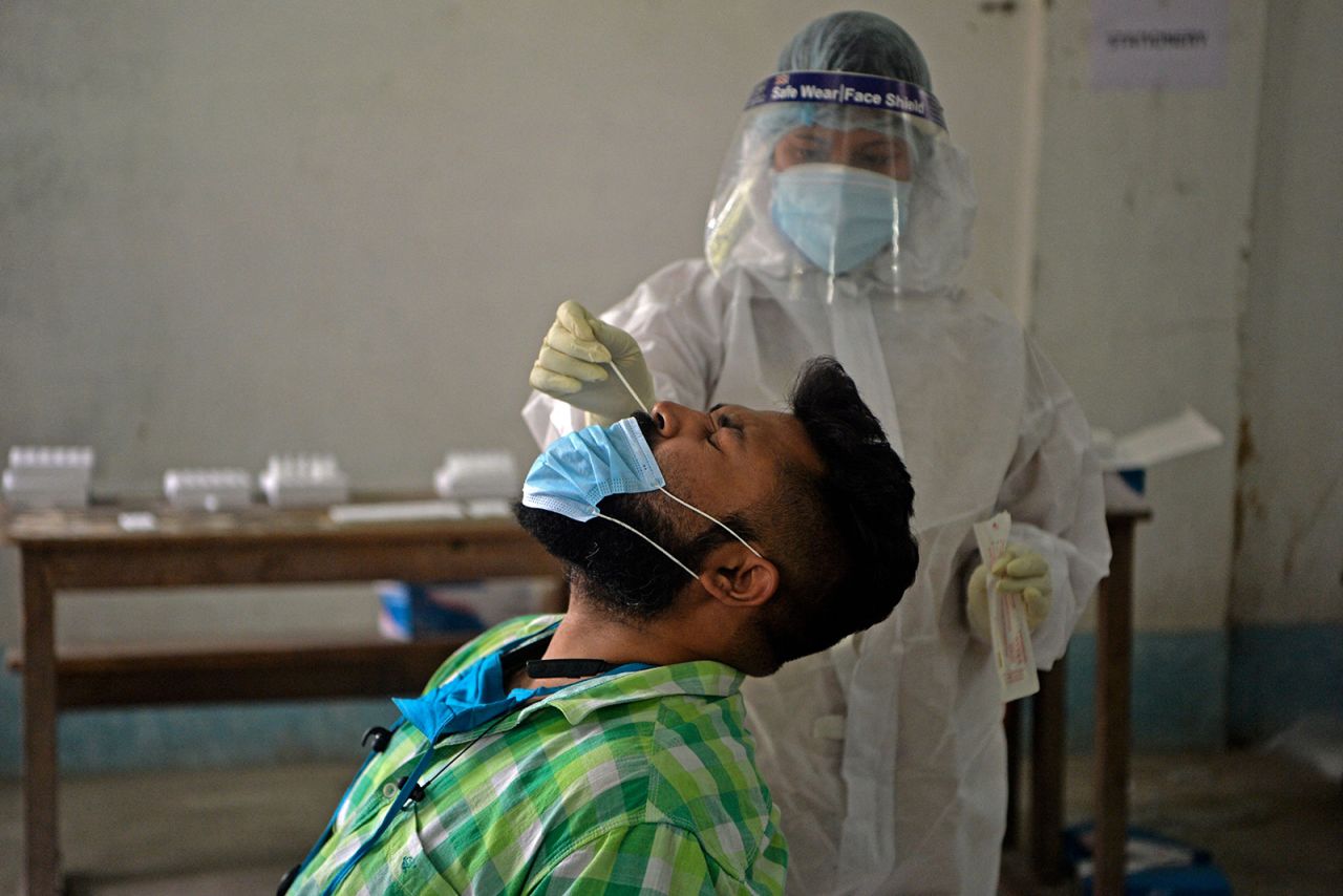 A health worker administers a Covid-19 test in Siliguri on April 30.