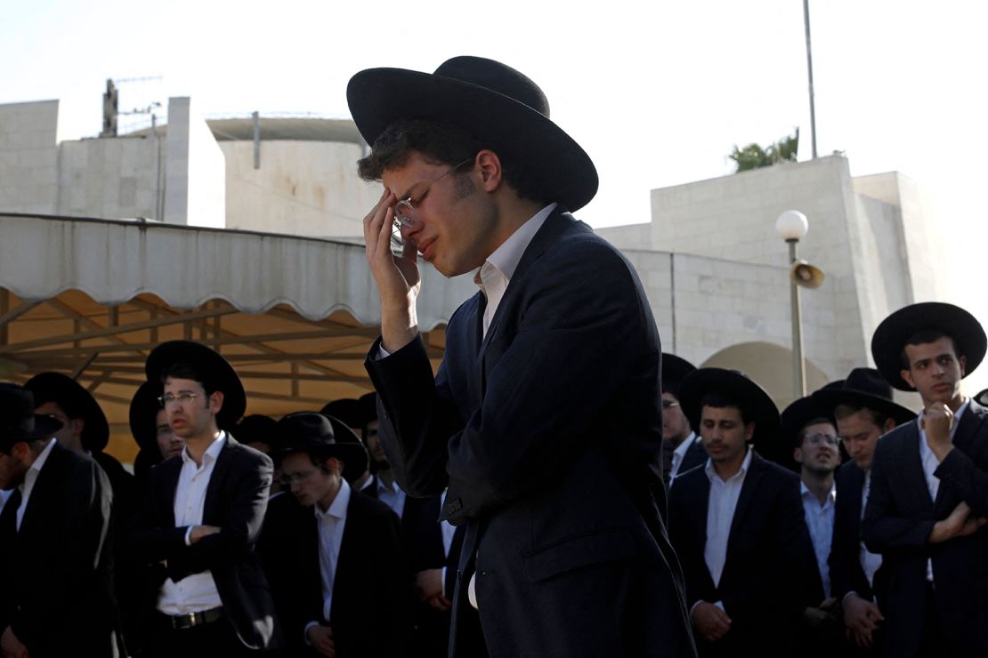 Ultra-Orthodox Jewish mourners attend the funeral of a victim of the stampede at Segula cemetery in Petah Tikva on April 30, 2021.