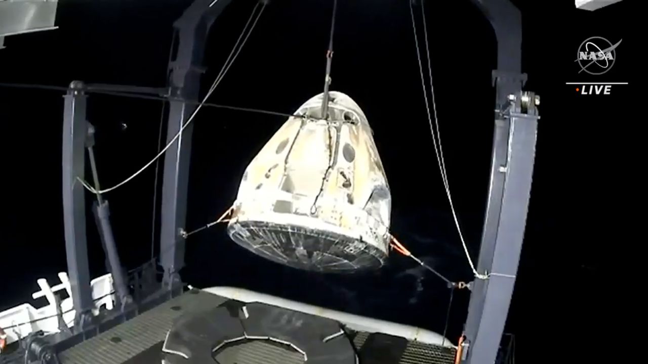 The capsule, with the astronauts on board, was raised from the Gulf of Mexico onto a ship