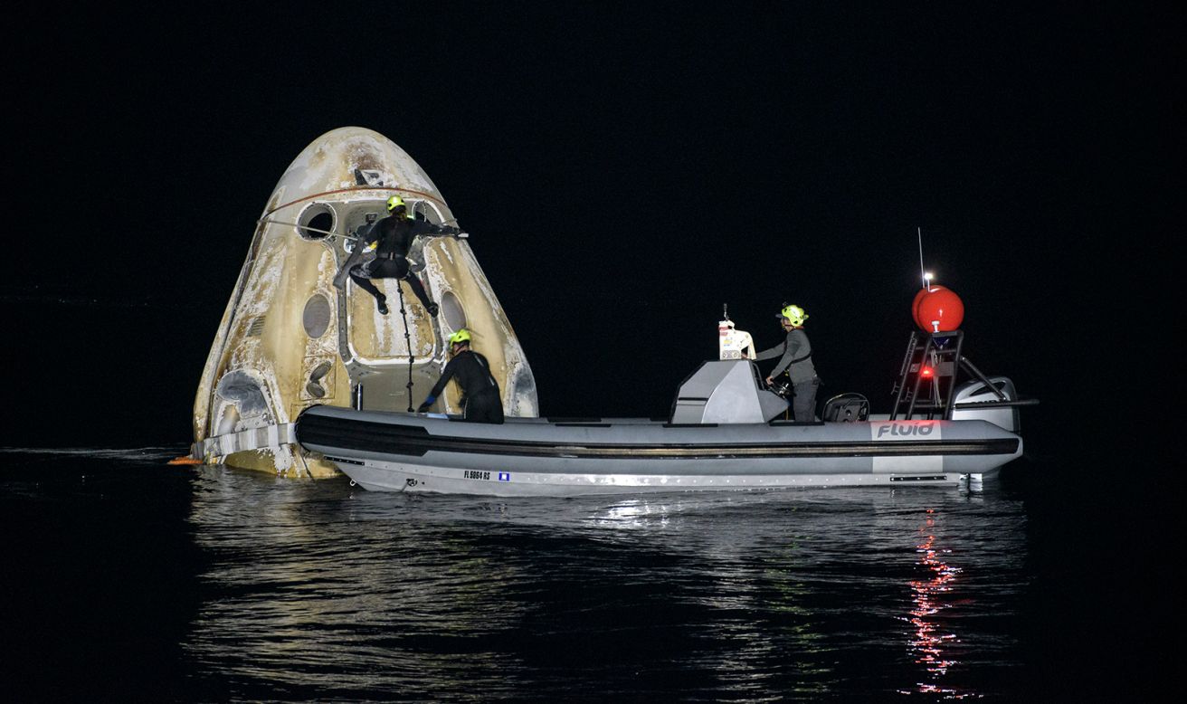 Support teams work around a SpaceX Crew Dragon spacecraft after it landed in the Gulf of Mexico on Sunday, May 2, <a href="https://www.cnn.com/2021/05/02/tech/nasa-spacex-astronauts-return-iss-highlights-scn/index.html" target="_blank">bringing back four astronauts from the International Space Station.</a>
