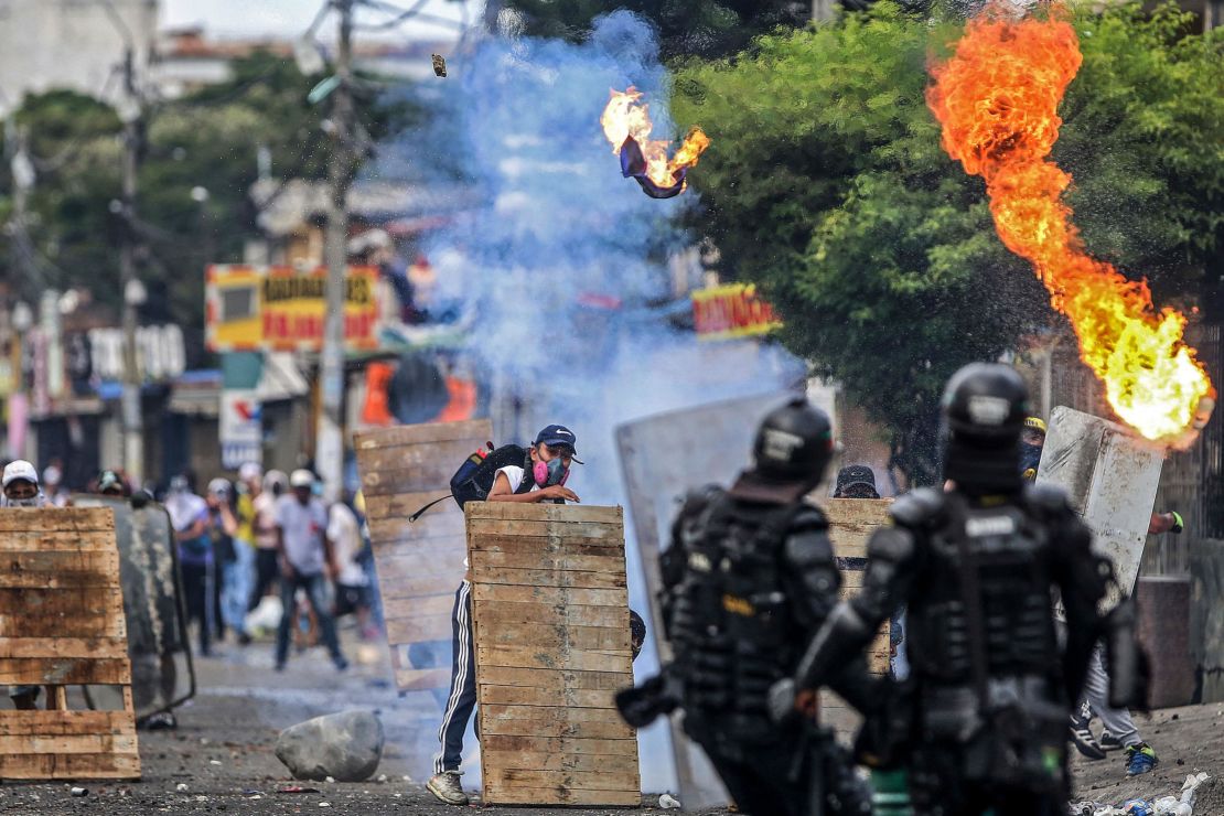 Demonstrators clash with riot police during a protest in Cali on April 29.