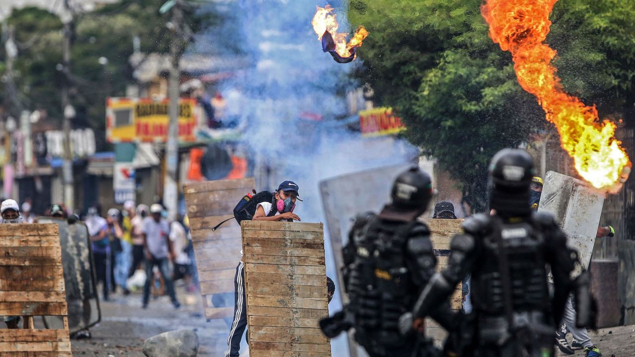 Demonstrators clash with riot police during a protest in Cali on April 29.