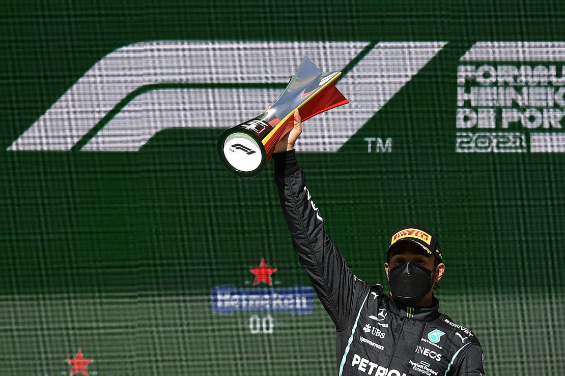 Hamilton celebrates on the podium after winning the Portuguese Grand Prix.