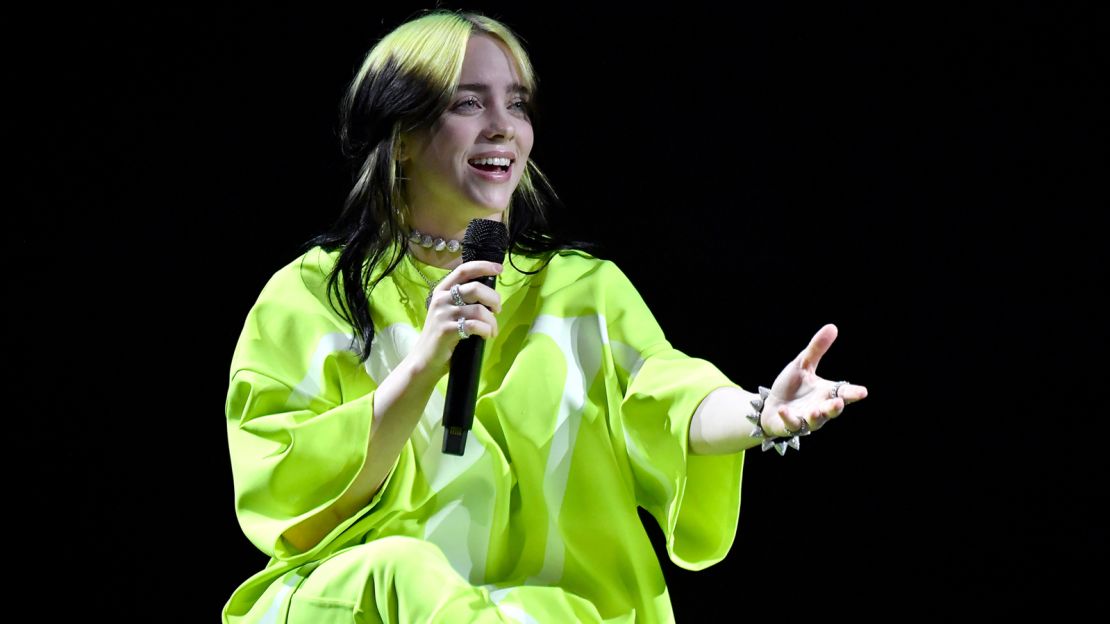 Billie Eilish ditched her trademark baggy clothes and green hair for the British Vogue photo shoot.
