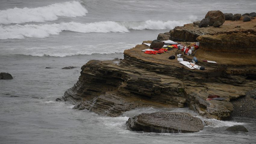 Items from a boat sit on the shoreline at Cabrillo National Monument near where it capsized just off the San Diego coast Sunday, May 2, 2021, in San Diego. Authorities say two people were killed and nearly two dozen others were hospitalized after the boat capsized. (AP Photo/Denis Poroy)
