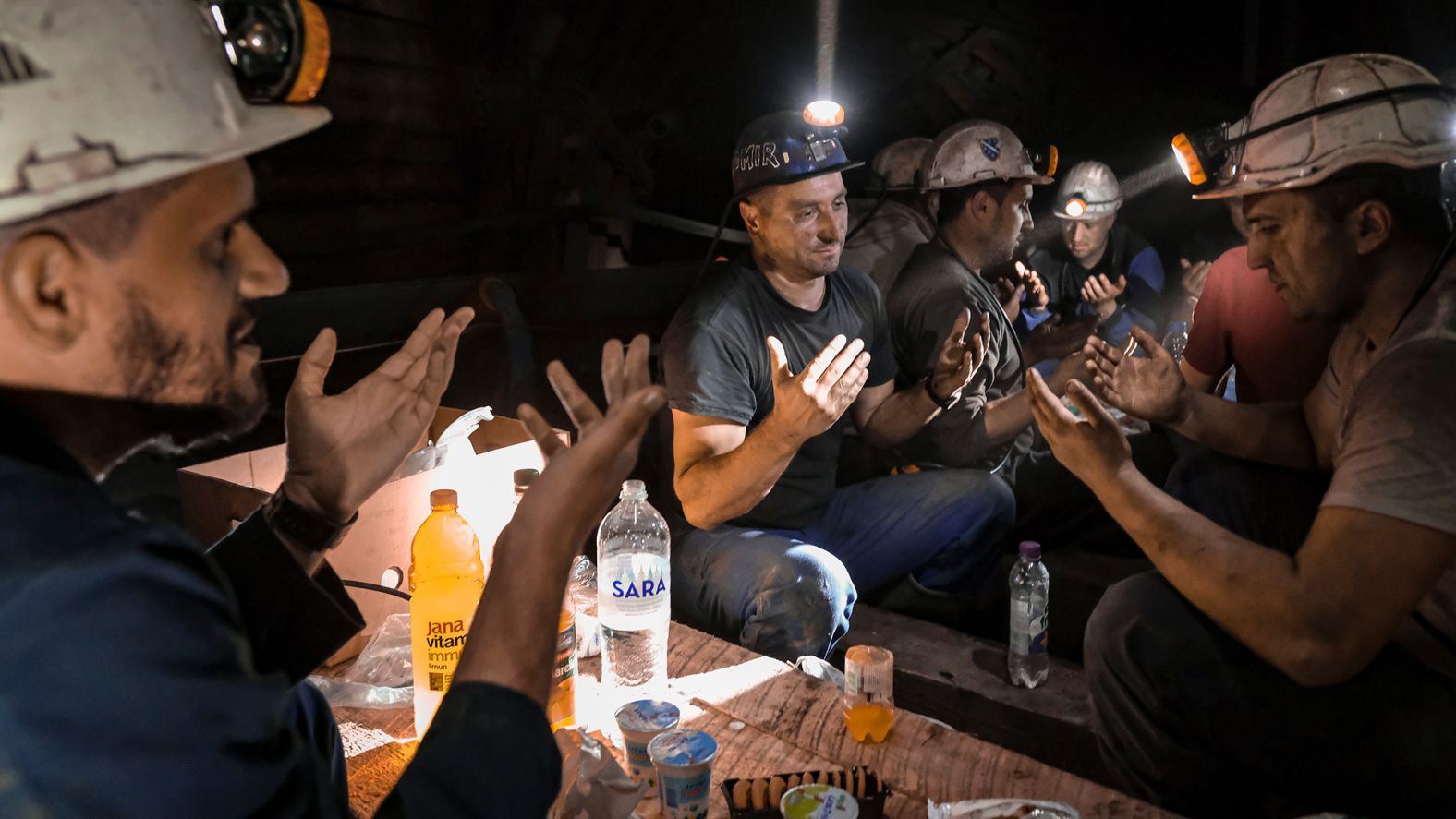 Coal miners pray as they break their fast underground in Zenica, Bosnia-Herzegovina, on April 29.